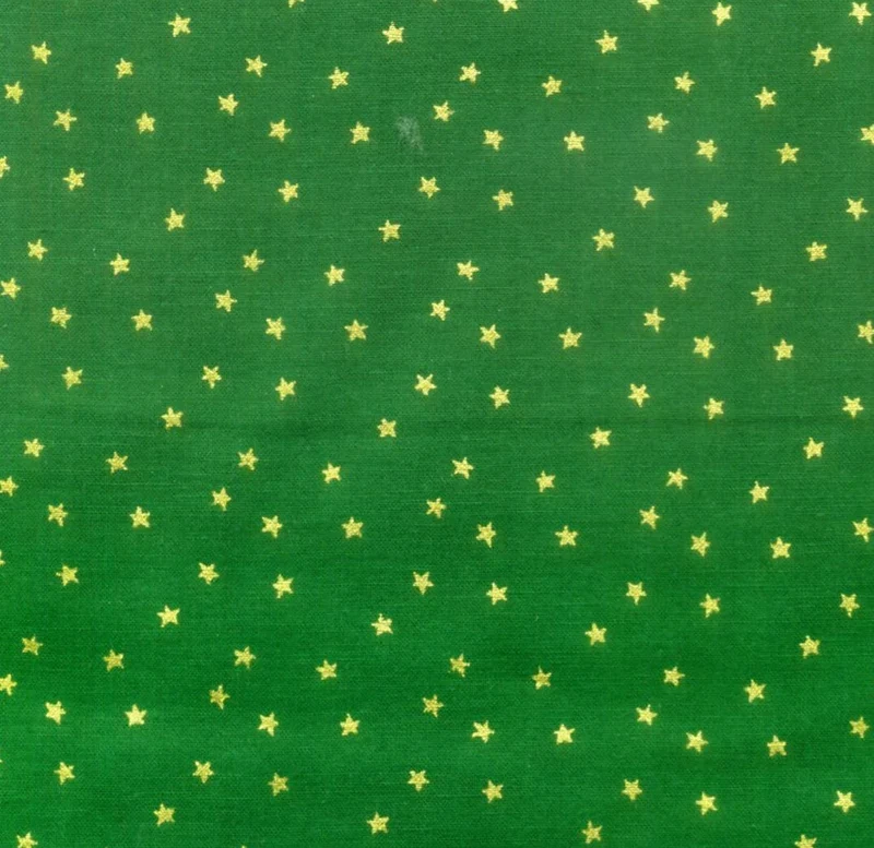 Small Metallic Gold Stars on Green
